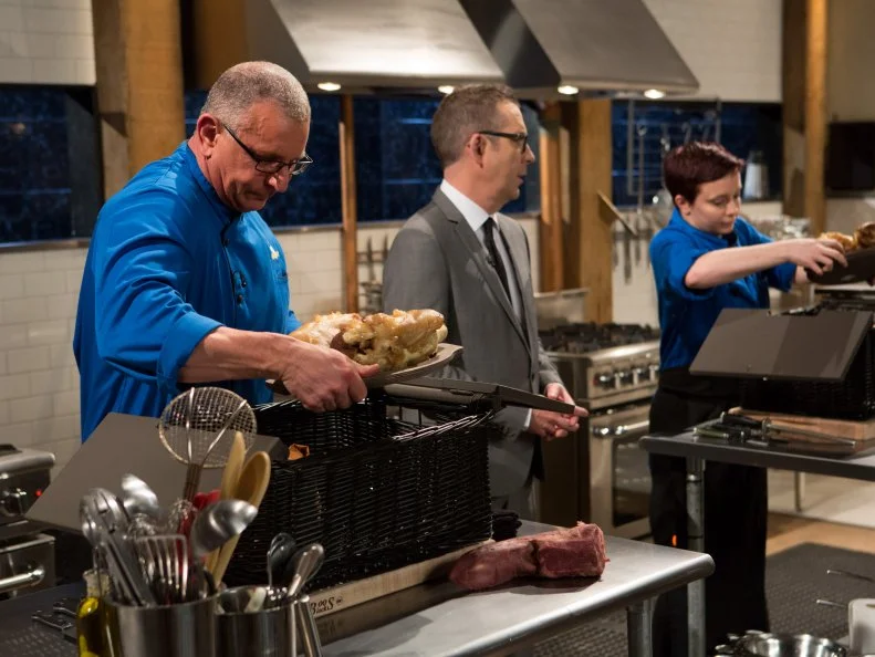 Chefs Robert Irvine and  Emily Chapman begin the sudden death round in which chef Chapman competes against chef Irvine for an additional $25,000 and the title of Chopped Impossible Champion, as seen on Food Network's Chopped, Season 27.