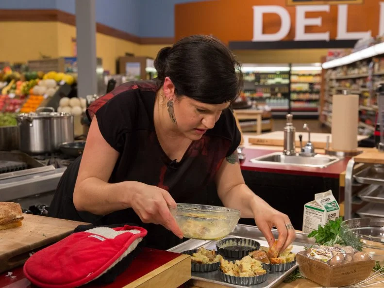 Chef Cristina Topham prepares her dish during Game 3, Food Wheel, as seen on Food Network's Guy's Grocery Games, Season 7.