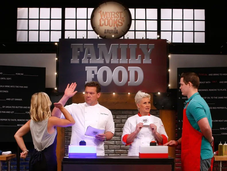 Co-Hosts Tyler Florence and Anne Burrell lead the recruits in a competition called "Family Food" as seen on Food Network's Worst Cooks in America, Season 8, Episode 2.