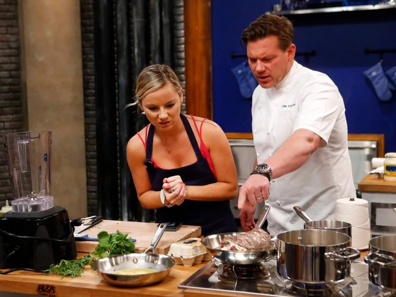 Host Tyler Florence checks in on blue team recruit Rachel Thomas as she prepares Florence's Filet Oscar with BŽarnaise and Rosemary Potatoes dish as seen on Food Network's Worst Cooks in America, Season 8.