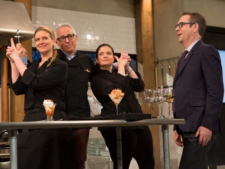Chopped after hours host Ted Allen and chefs Alex Guarnaschelli, Geoffrey Zakarian and Amanda Freitag taste and discuss their dishes that must have included April fools day ingredients that are not what they seem: grilled cheese sandwiches = pound cake and frosting, tomato soup = strawberry puree, milk = buttermilk, peas and carrots = jelly beans, as seen on Food Network's chopped After Hours, season 23. as seen on Food Network's Chopped After Hours, Season 23.
