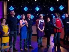 Cook Sharon Damante (L), Chef Curtis Stone, Vanessa Craig, Chef Michael Symon, August Dannehl, Alex Guarnaschelli, Joseph Harris, and Chef Bobby Flay during judging of the first challenge, recipe scramble, as seen on Food Network's All-Star Academy, Season 1.