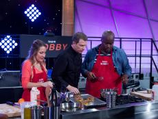 Chef Bobby Flay mentors participant cooks Angela George (L) and Joseph Harris of Team Bobby during first challenge, Team Curtis vs Team Bobby, Tortilla Chips, as seen on Food Network's All-Star Academy, Season 1.