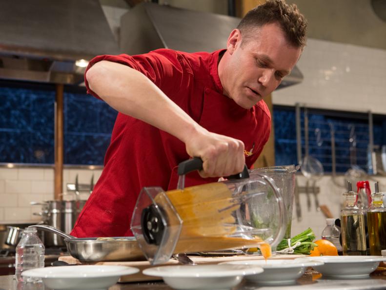 Chef Brian Malarkey works on his appetizer that must include: smoked pork tails, Culantro, Natto and clamsfor Chopped $75,000 charity All-Stars competition, as seen on Food Network's Chopped, Season 24.