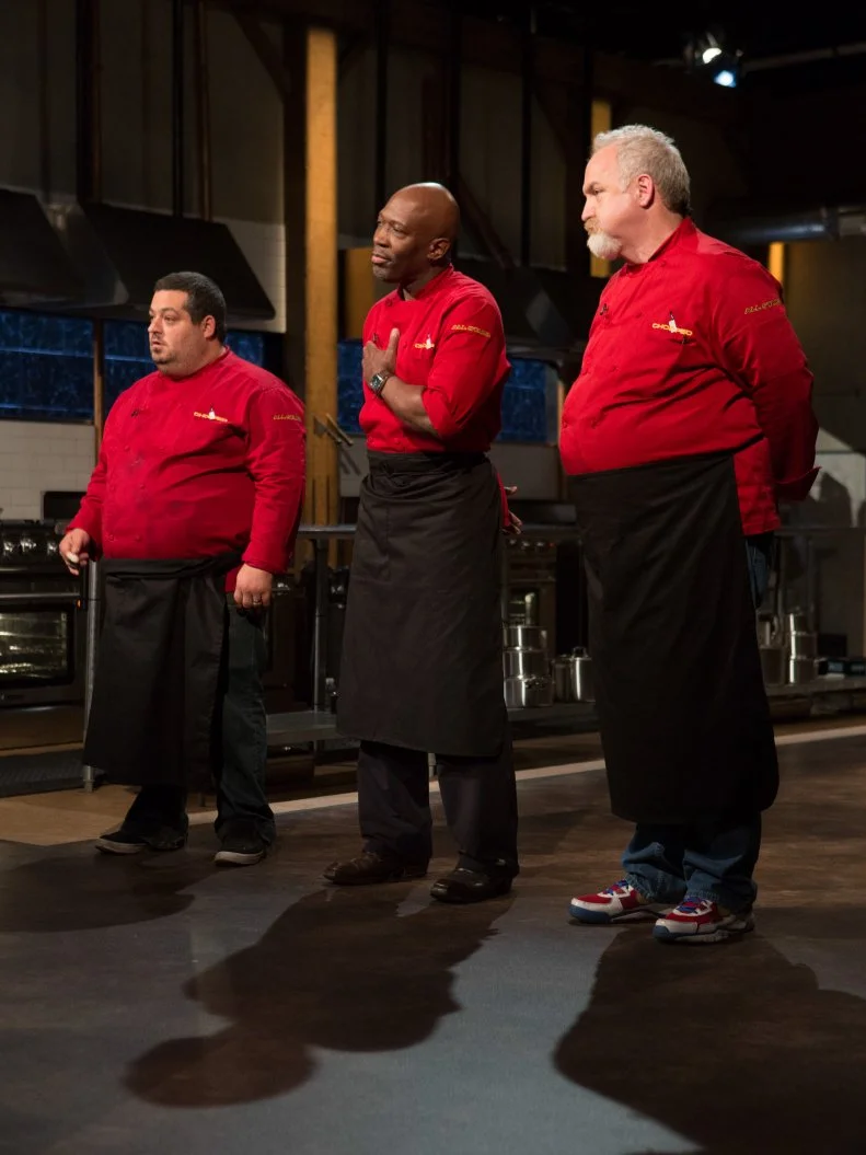 Chefs: Eric Greenspan, Madison Cowan and Art Smith react to finding out which chefs will move on to the next round and which chef has been Choppedfor Chopped $75,000 charity All-Stars competition, as seen on Food Network's Chopped, Season 24.