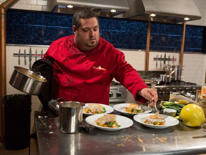 Chef Eric Greenspan works on his entree that must include: shrimp skin, Hamachi, Pomelo and fresh green garlicfor Chopped $75,000 charity All-Stars competition, as seen on Food Network's Chopped, Season 24.