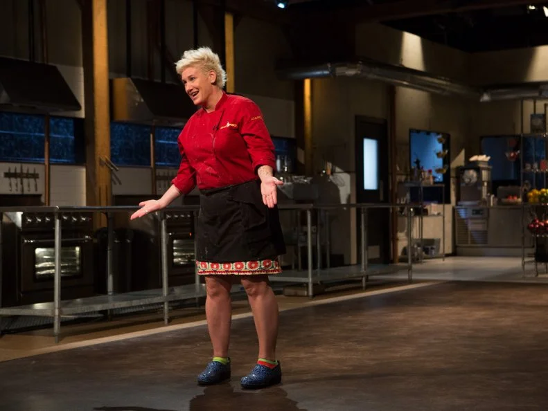 Chef Anne Burrell reacts to finding out she has secured a spot in the $75,000 charity final, as seen on Food Network's Chopped, Season 24.