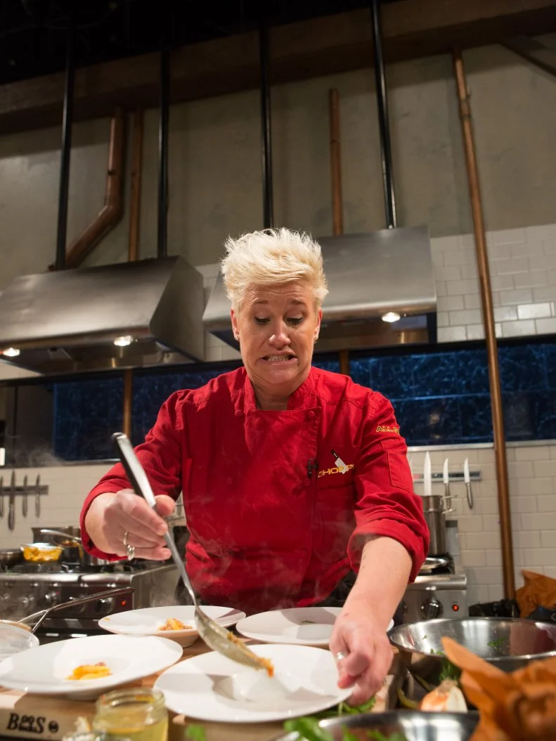 Chef Anne Burrell working on her appetizer that must include: solomilo iberico, preserved lemons, arugula and African peanut soup for Chopped $75,000 charity All-Stars competition, as seen on Food Network's Chopped, Season 24.