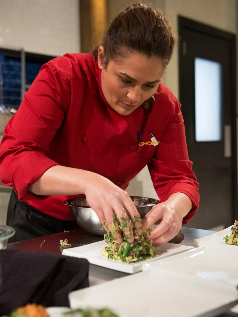 Chef Antonia Lofaso working on her appetizer that must include: Mojama, baby zucchini, macron almonds and coconut macaroons for Chopped All-Stars $75,000 charity competition, as seen on Food Network's Chopped, Season 24.