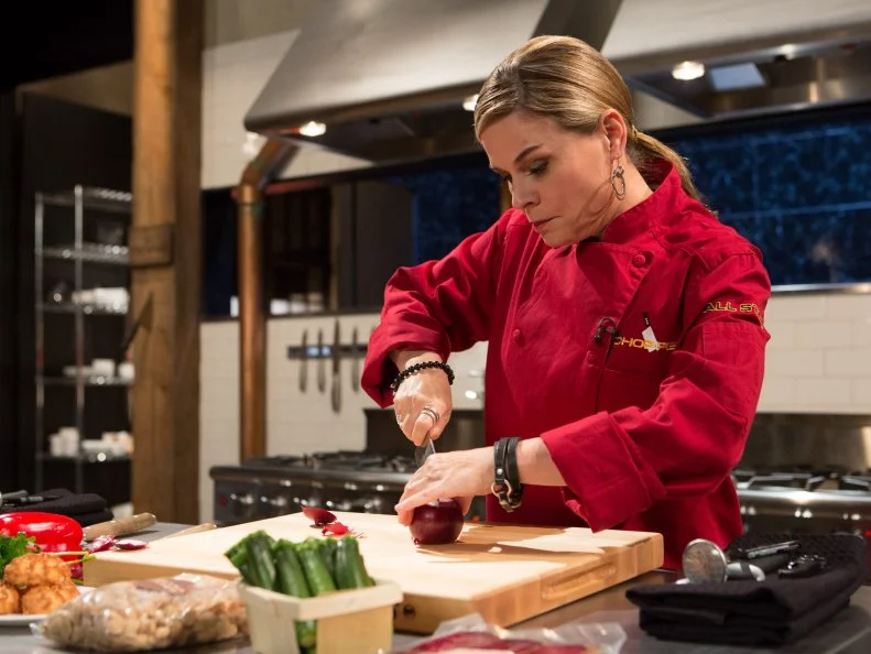 Chef Cat Cora working on her appetizer that must include: Mojama, baby zucchini, macron almonds and coconut macaroons for Chopped All-Stars $75,000 charity competition, as seen on Food Network's Chopped, Season 24.