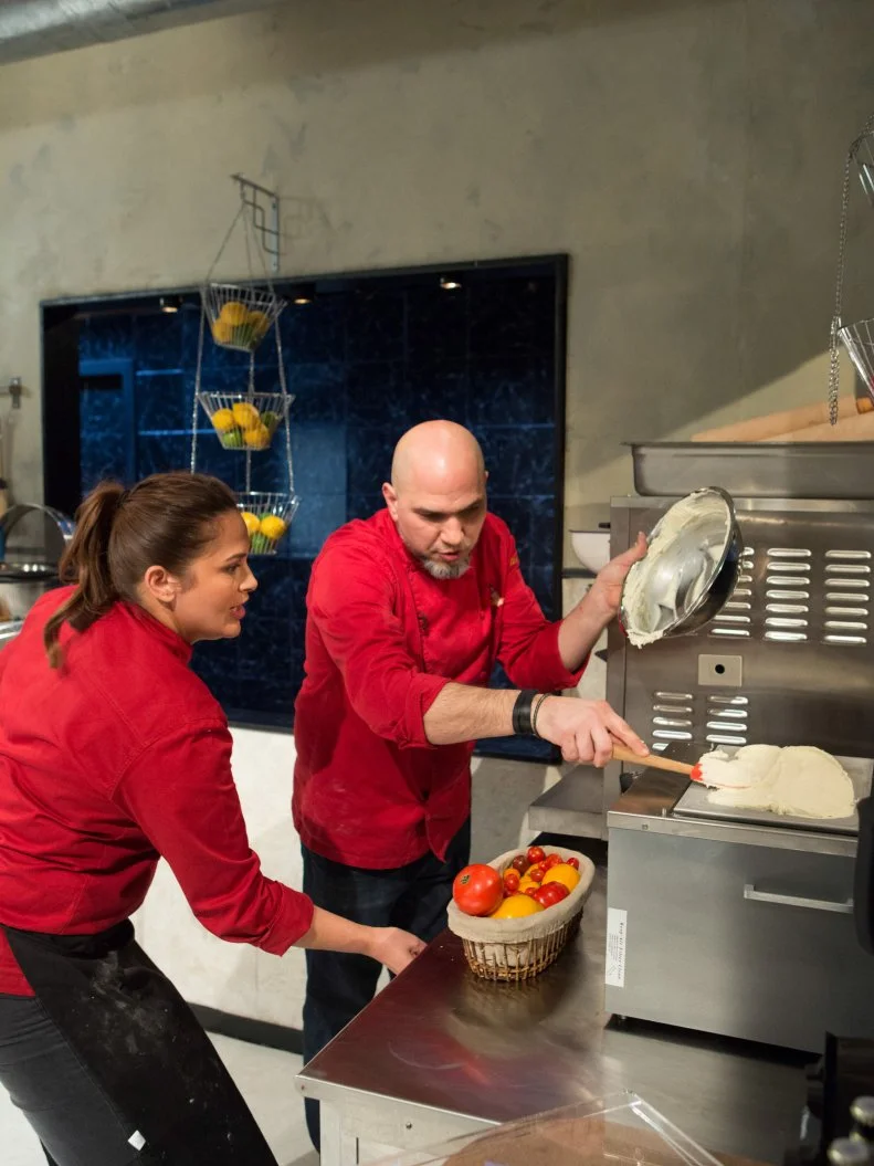 Chefs Antonia Lofaso and Michael Psilakis work on their desserts that must include: ghee, m'smen, whole walnuts and orange flavored water for Chopped All-Stars $75,000 charity competition, as seen on Food Network's Chopped, Season 24.