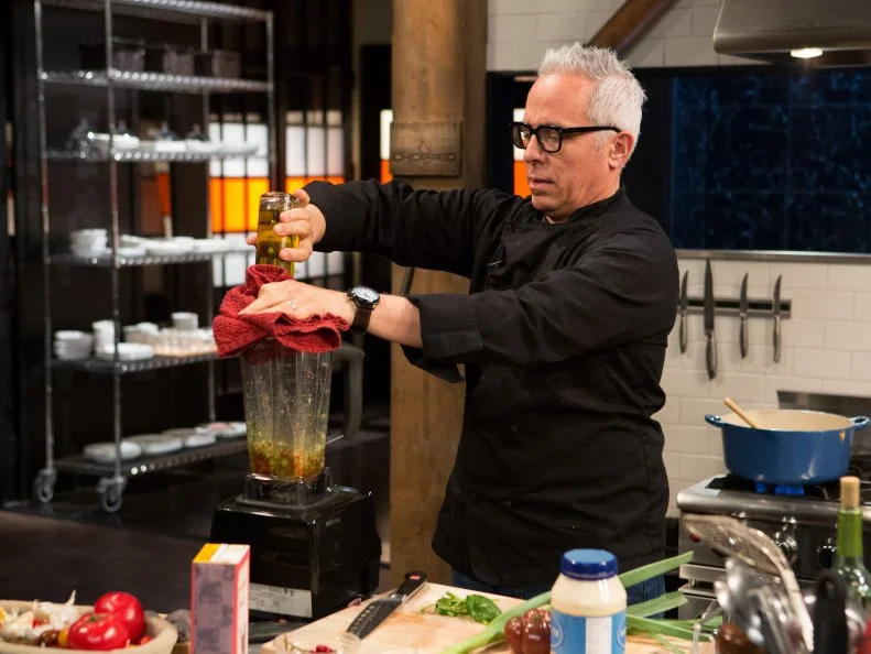 Chef Geoffrey Zakarian works on his appetizer made from the mystery basket ingredients from episode-24-07 (all star finale) are: fish carcass, calabrian chiles, tasso ham and purple potatoes, as seen on Food Networks Chopped, season 27 webisode