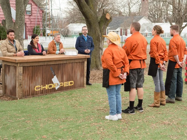 Chefs: Matty Melehes, Mary Brent Gaylean, Stan Hays and Candy Sue Weaver stand before Chopped host Ted Allen and judges: Scott Conant, Alex Guarnaschelli and Tim Love moments before finding out which chefs will move on to cook in the next round and which chef will be Chopped, as seen on Food Network's Chopped, Grill Masters Special.