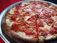 At Totonno’s, the current owners serve up irresistible pizzas made from their grandfather's secret recipe. Their most-popular pie is topped with mozzarella, pepperoni, fresh mushrooms, sauce, a dusting of Parmesan and a drizzle of extra virgin olive oil before going into a coal-fired oven.