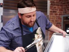 Finalist Jay Ducote preparing his dish, Grilled Whole Branzino with Roasted Brussels Sprouts, for the Mentor Challenge, Mismatched, as seen on Food Network Star, Season 11.