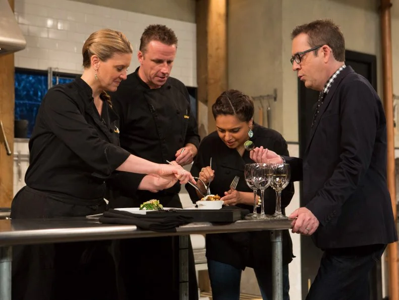 Chopped host Ted Allen tasting and discussing with chefs Maneet Chauhan, Marc Murphy and Amanda Freitag, the chefs each made dishes that must include: North Carolina style bbq sauce, pork spare ribs, rainbow chard and avacados, as seen on Food Network's Chopped After Hours, Season 23.