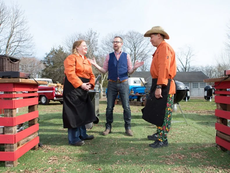 Chefs Leslie Roark Scott and Harry Soo stand before Chopped host Ted Allen moments before starting the dessert round, as seen on Food Network's Chopped, Grill Masters Special.