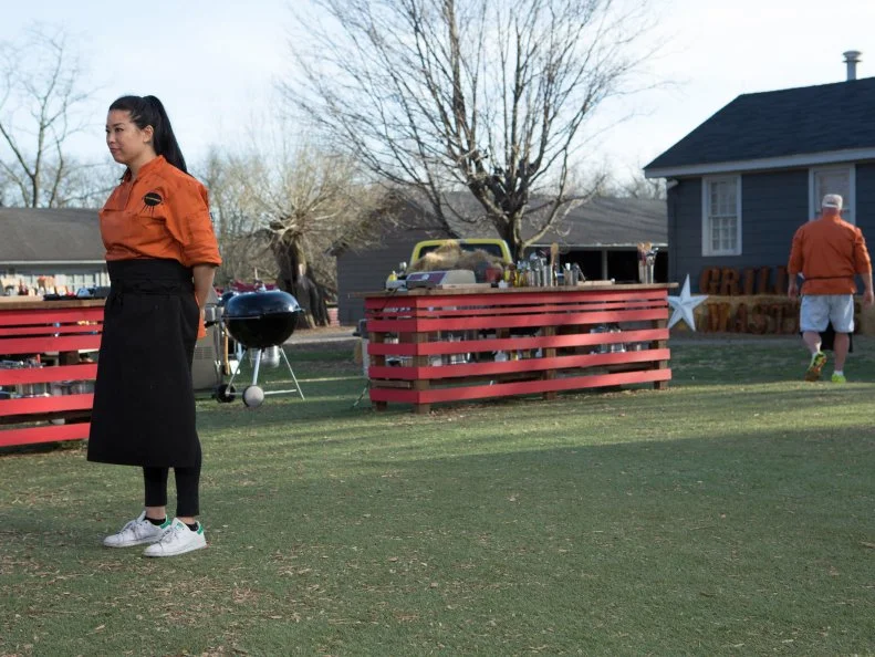 Chef Angie Mar stands before Chopped host Ted Allen and judges: Scott Conant, Amy Mills and Chris Santos moments after finding out she has become a Chopped Champion as secured a spot in the $50,000 finale, as seen on Food Network's Chopped, Grill Masters Special.