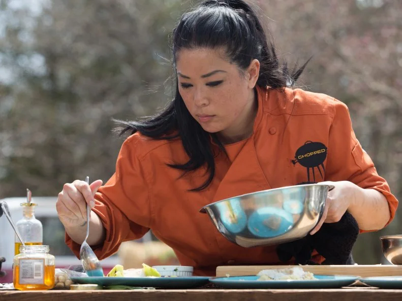 Chef Angie Mar works on her entree that must include: Monchong (fish) ramps, macadamia nuts and galia melon, as seen on Food Network's Chopped, Grill Masters Special.