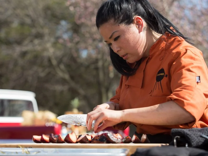 Chef Angie Mar works on her dessert that must include: plums, halloumi cheese, poor mans toffee and white bbq sauce, as seen on Food Network's Chopped, Grill Masters Special.