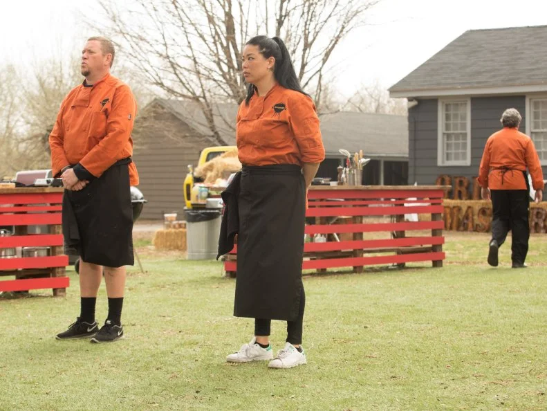Chefs: Stan Hays, Chris Hart and Angie Mar stand react to Chopped host Ted Allen and judges: Scott Conant, Alex Guarnaschelli and Chris Santos after finding out which two chefs will compete in the dessert round for the $50,000 prize and which chef has been Chopped, as seen on Food Network's Chopped, Grill Masters Special.