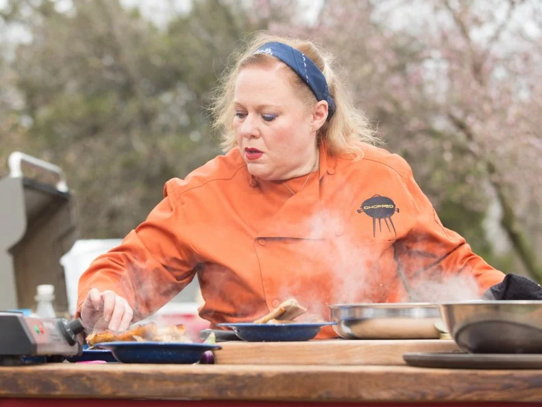 Chef Leslie Roark Scott works on her appetizer that must include: rattlesnake, lemonade and iced tea drink, Japanese eggplant and hush puppies, as seen on Food Network's Chopped, Grill Masters Special.