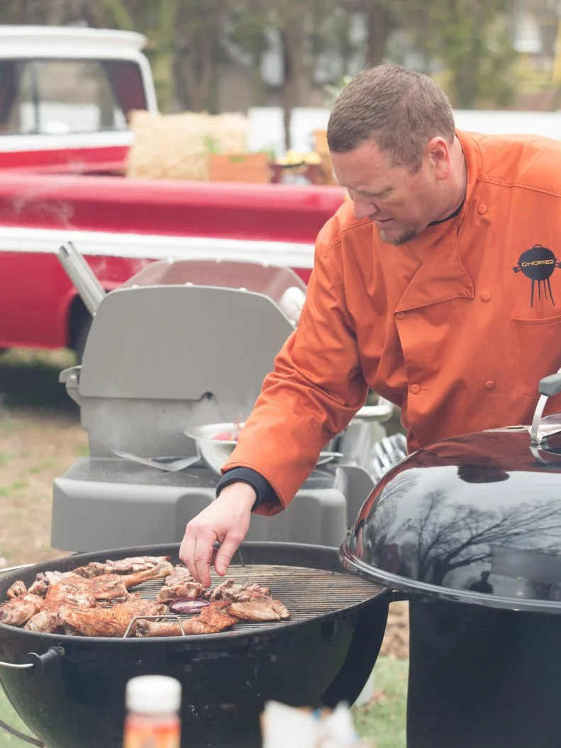 Chef Stan Hays works on his entree that must include: baby goat, rainbow carrots, watermelon and kokoretsi, as seen on Food Network's Chopped, Grill Masters Special.