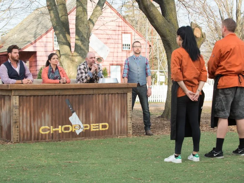 Chefs Angie Mar and Stan Hays stand before Chopped host Ted Allen and  judges: Scott Conant, Alex Guarnaschelli and Chris Santos moments before finding out which chef has been Chopped and which chef has won the $50,0000 Grill Masters competition ,  as seen on Food Network's Chopped, Grill Masters Special.
