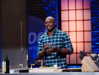 Finalist Eddie Jackson preparing his dish, Caribbean Spiced Meatball with Carrot and Ginger Puree, for the Cook For Your Life challenge, as seen on Food Network Star, Season 11.