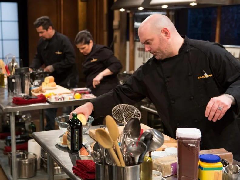 Chopped Chefs: Aaron Sanchez, Alex Guranaschelli and Chris Santos work on their desserts using the the mystery basket ingredients, as seen on Food Network's Chopped After Hours, Season 24.