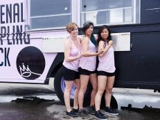Team Pho-Nomenal Dumpling's Becca Ruffin, Sophia Woo and Sunny Lin in front of their truck, as seen on Food Networkâ  s The Great Food Truck Race, Season 6.