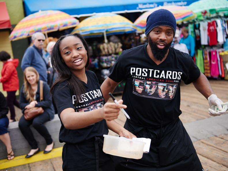 Team Postcard's Grae King and Greg King taking orders for their dishes for the Santa Monica Signature Challenge, as seen on Food Networkâ  s The Great Food Truck Race, Season 6.