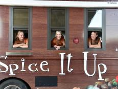 Nicole Miller, Chris Paciora and Keri Frazier of team Spice It Up pose inside their food truck at Lake Havasu, Arizona as seen on Food Networkâ  s The Great Food Truck Race, Season 6.
