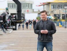 Behind the scenes as host, Tyler Florence, opens up the show at the end of Route 66, in Santa Monica, California, as seen on Food Network's The Great Food Truck Race, Season 6.