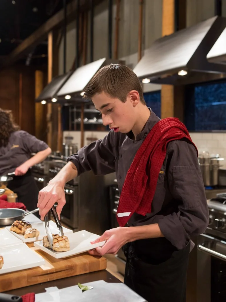 14 year old Franco Fugel works on his appetizer that must include:swordfish, black garlic mayonnaise, lemon leaves and bears head mushrooms for Chopped Teen Week $25,000 tournament, as seen on Food Network's Chopped, Season 25.