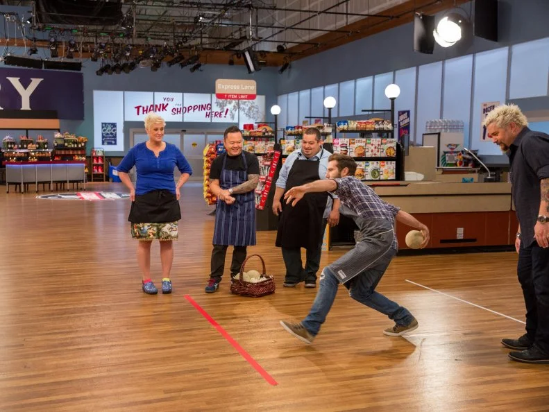 Host Guy Fieri with Celebrity Chefs Anne Burrell, Jet Tila, Eric Greenspan, and Marcel Vigneron during  Game 1, Grocery Bowl, as seen on Food Network's Guy's Grocery Games, Season 7.