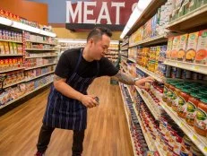 Celebrity Chef Jet Tila searches for ingredients during shopping for Game 2, Meals from the Middle, as seen on Food Network's Guy's Grocery Games, Season 7.