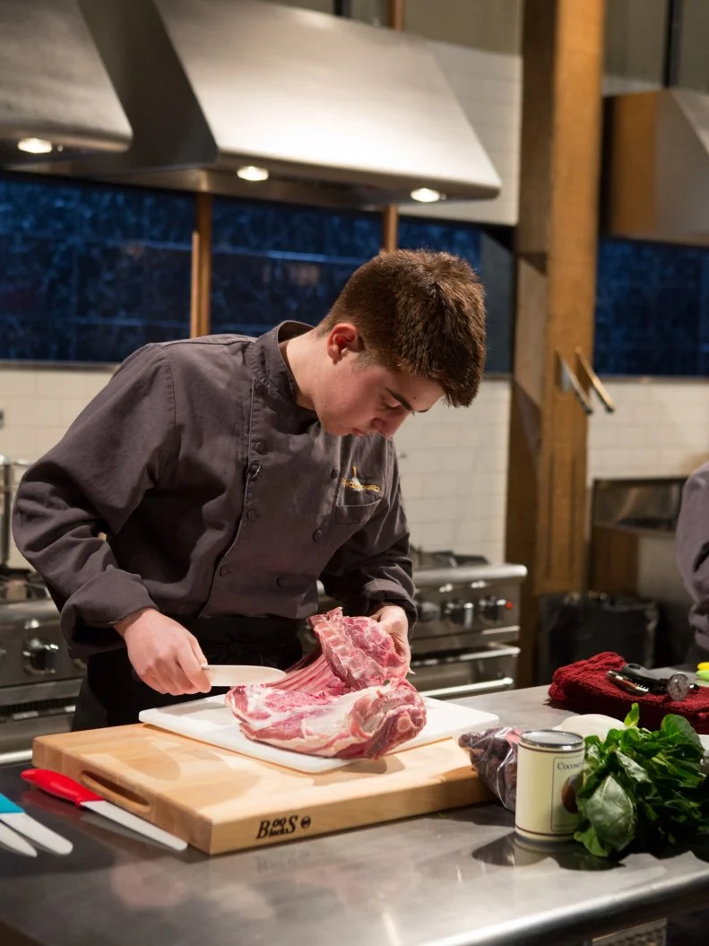 17 year old Nino Asaro works on his entree that must include:  lamb shoulder, bok choy, coconut milk and dates for Chopped Teen Week $25,000 tournament, as seen on Food Network's Chopped, Season 25.