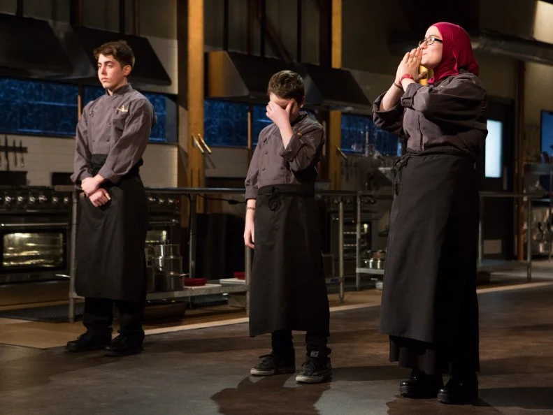 (L-R) Teens: 17 year old Nino Asaro, 13 year old Peter Wenger and 15 year old Salma Zahran stand before Chopped host Ted Allen and judges: Scott Conant, Maneet Chauhan and Amanda Freitag moments after finding out which teens will move on to cook in the next round and which teen has been Chopped for Chopped Teen Week $25,000 tournament, as seen on Food Network's Chopped, Season 25.