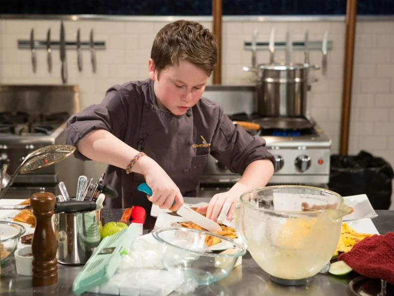 13 year old Peter Wenger works on his dessert that must include: powdered peanut butter, ice cream sandwiches, marshmallows and curry powder for Chopped Teen Week $25,000 tournament, as seen on Food Network's Chopped, Season 25.