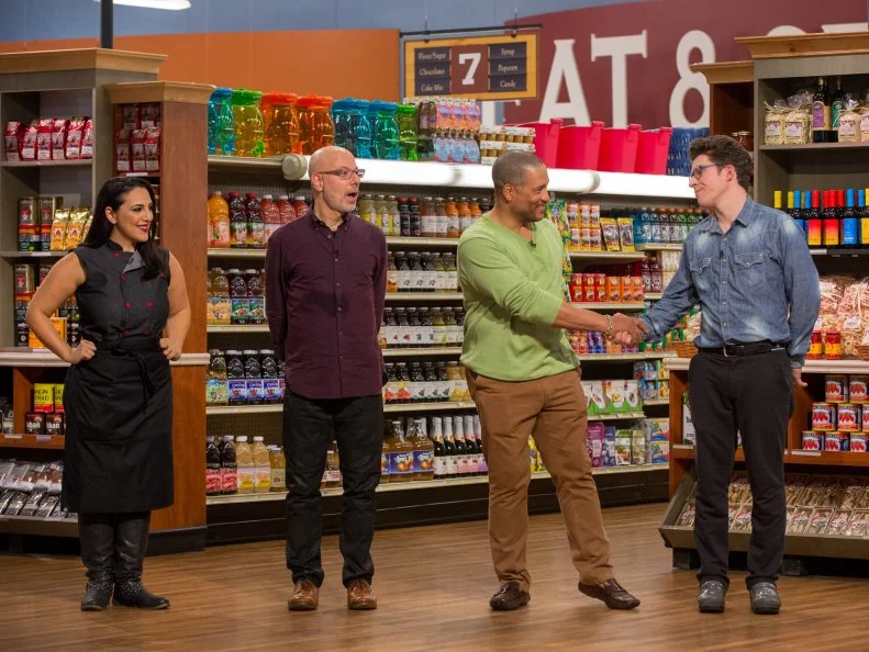 Celebrity Chefs Penny Davidi, Ron Ben-Israel, Pat Neely, and Justin Warner during judging for Game 1, Red Light Special, as seen on Food Network's Guy's Grocery Games, Season 7.