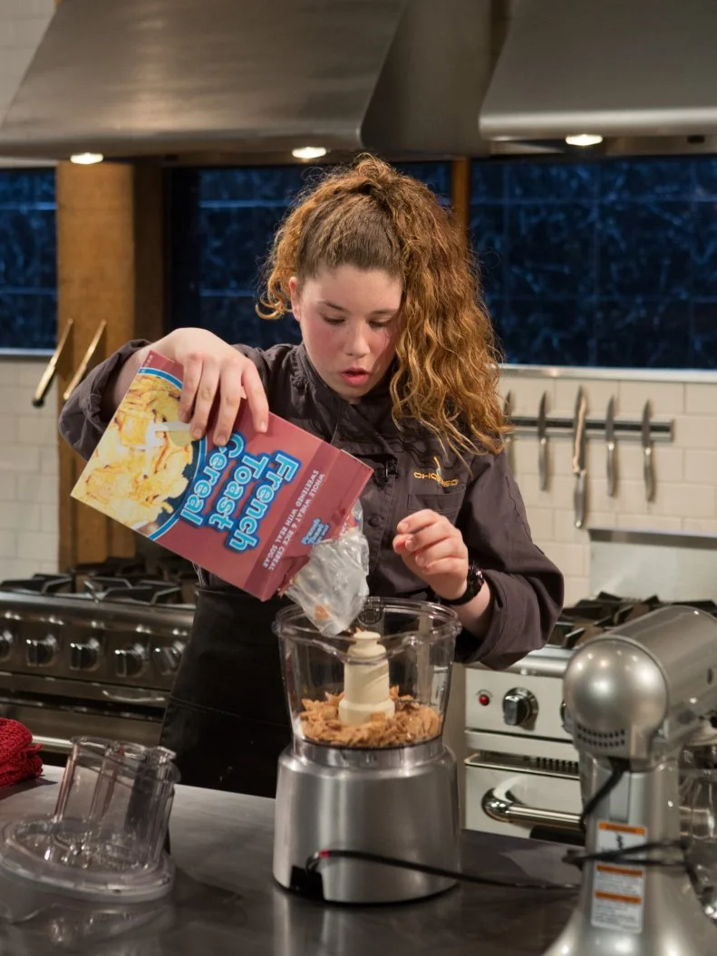14 year old Alexina Chasin working on her dessert that must include: walnuts in honey, late night cookies, plums and french toast cereal for Chopped Teen Week $25,000 tournament, as seen on Food Network's Chopped, Season 25.