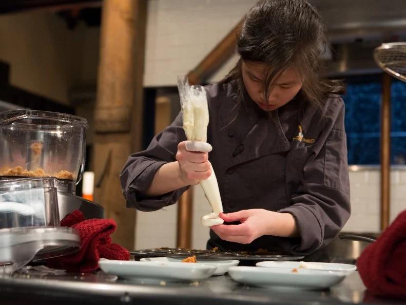 13 year old Allison Lee working on her dessert that must include: walnuts in honey, late night cookies, plums and french toast cereal for Chopped Teen Week $25,000 tournament, as seen on Food Network's Chopped, Season 25.