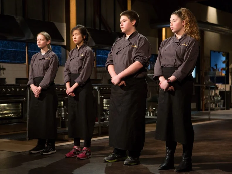 13 year old Eliza McKelvey, 13 year old Allison Lee, 14 year old Jarren Pross and 14 year old Alexina Chasin stand before Chopped host Ted Allen and judges: Scott Conant, Alex Guarnaschelli and Chris Santos moments  before finding out which teens will move to cook in the next round and which teen has been Chopped for Chopped Teen Week $25,000 tournament, as seen on Food Network's Chopped, Season 25.
