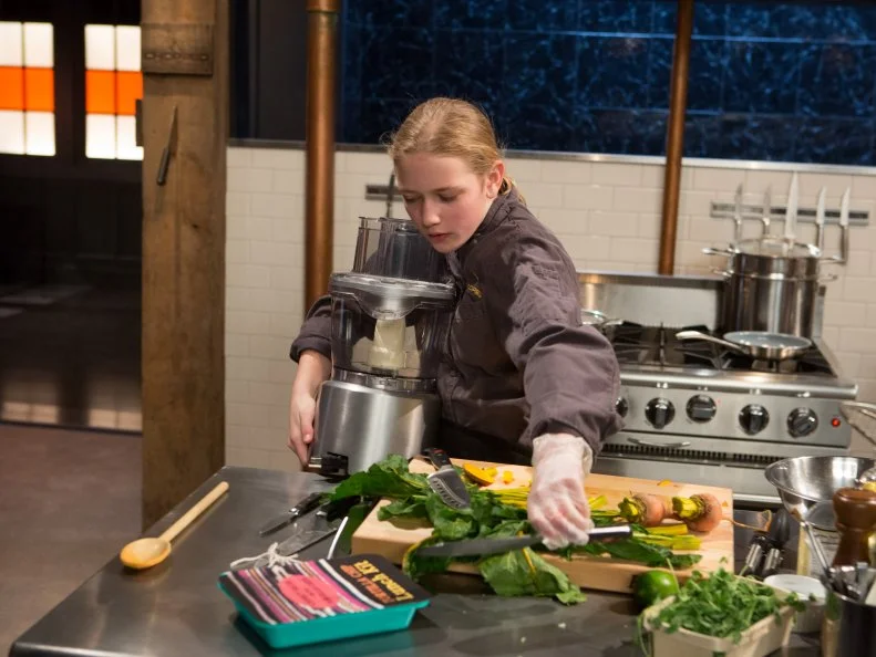 13 year old Eliza McKelvey works on her appetizer that must include: vegan crispy chicken legs, golden beets, chips and salsa lunch kit and pea leaves for Chopped Teen Week $25,000 tournament, as seen on Food Network's Chopped, Season 25.