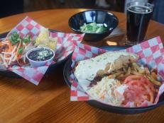 The crowds flock here for comforting Southern eats with an international flair. Michael Symon enjoys the Beer Belly Taco, which stars hickory-smoked pork piled onto a corn tortilla and finished with Asian-inspired toppings like pickled carrots. Classic dishes like chicken-fried steak are also a hit.