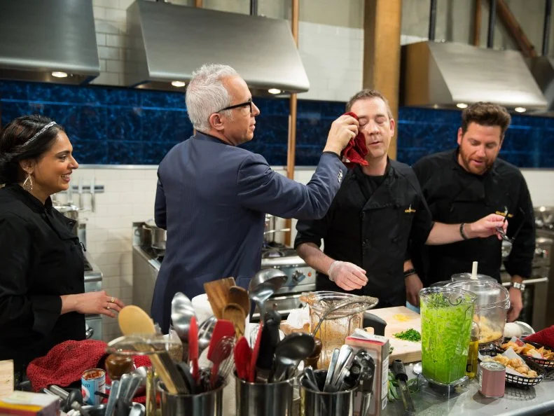 Maneet Chauhan, Geoffrey Zakarian, Ted Allen and Scott Conant during a carnival theme webisode cooking with hot beef sundae,deep fried ravioli, asparagus, and deep fried canned ham, as seen on Food Networkâ  s Chopped, season 24.