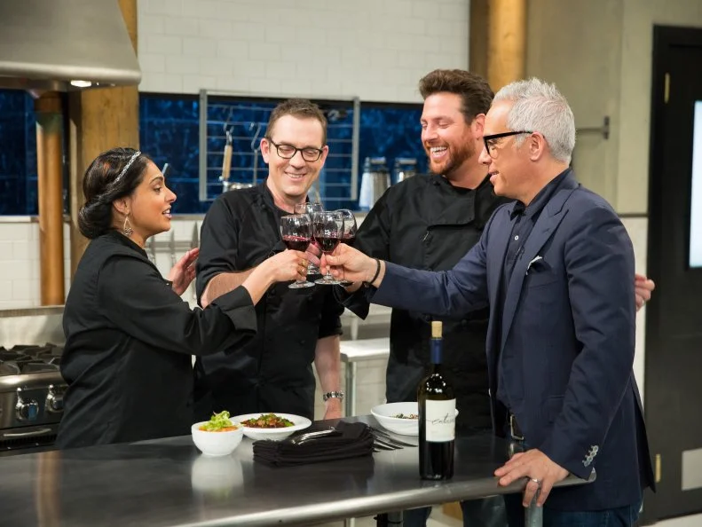 Ted Allen, Maneet Chauhan, Geoffrey Zakarian, and Scott Conant on a webisode with a carnival theme, as seen on Food Networkâ  s Chopped, season 24.