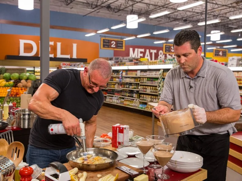 Celebrity Chef Robert Irvine and Pro Athlete Rich Aurilia prepare their dish during Game 3, One Ingredient At A Time, as seen on Food Network's Guy's Grocery Games, Season 7.