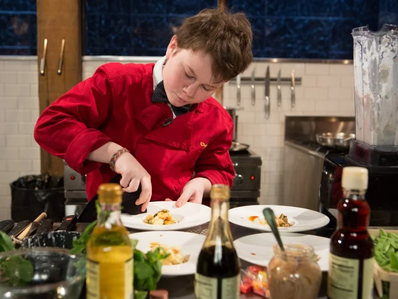 Teen Chopped champion 13 year old Peter Wenger works on his appetizer that must include: tuna in oil, sugar snap peas, fruit candy squares and gnocchi for Chopped Teen Week $25,000 tournament, as seen on Food Network's Chopped, Season 25.